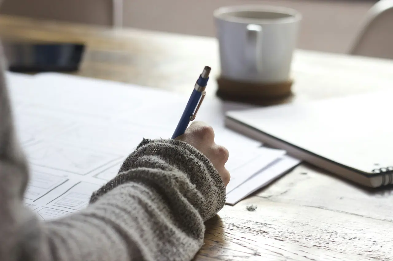 Person studying educational materials at a quiet desk